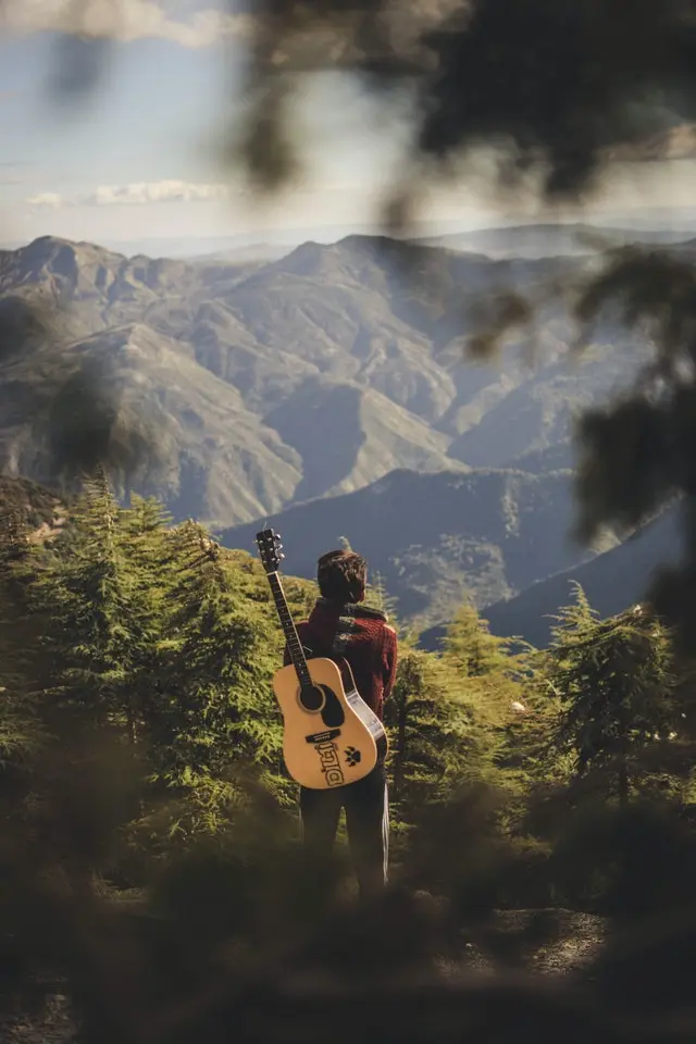 Solo musician traveler in the mountains